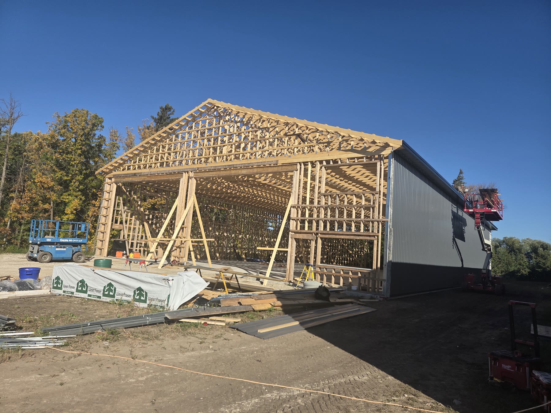 A shop being framed, with the roof trusses up